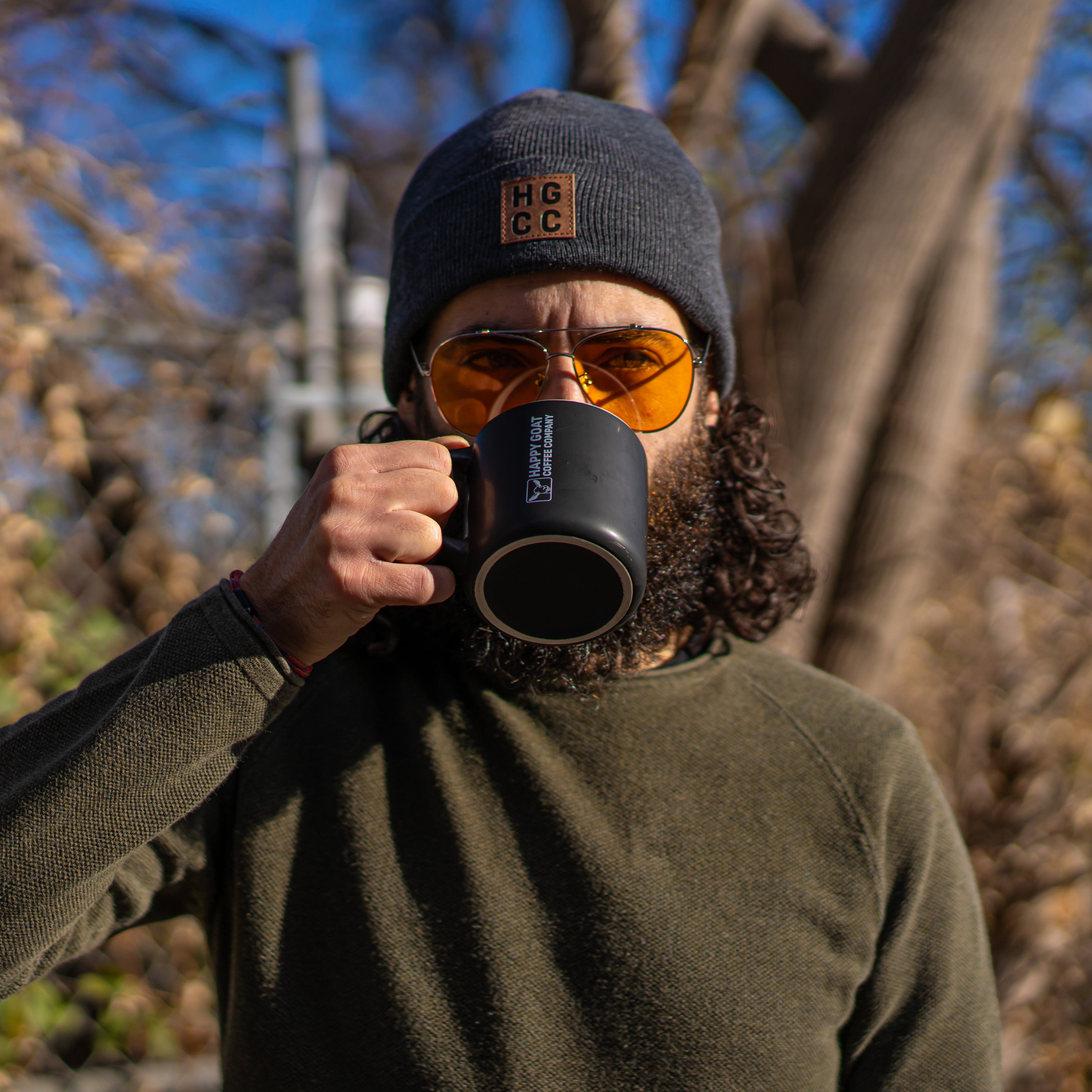 Happy Goat Touque in dark grey color, worn by model