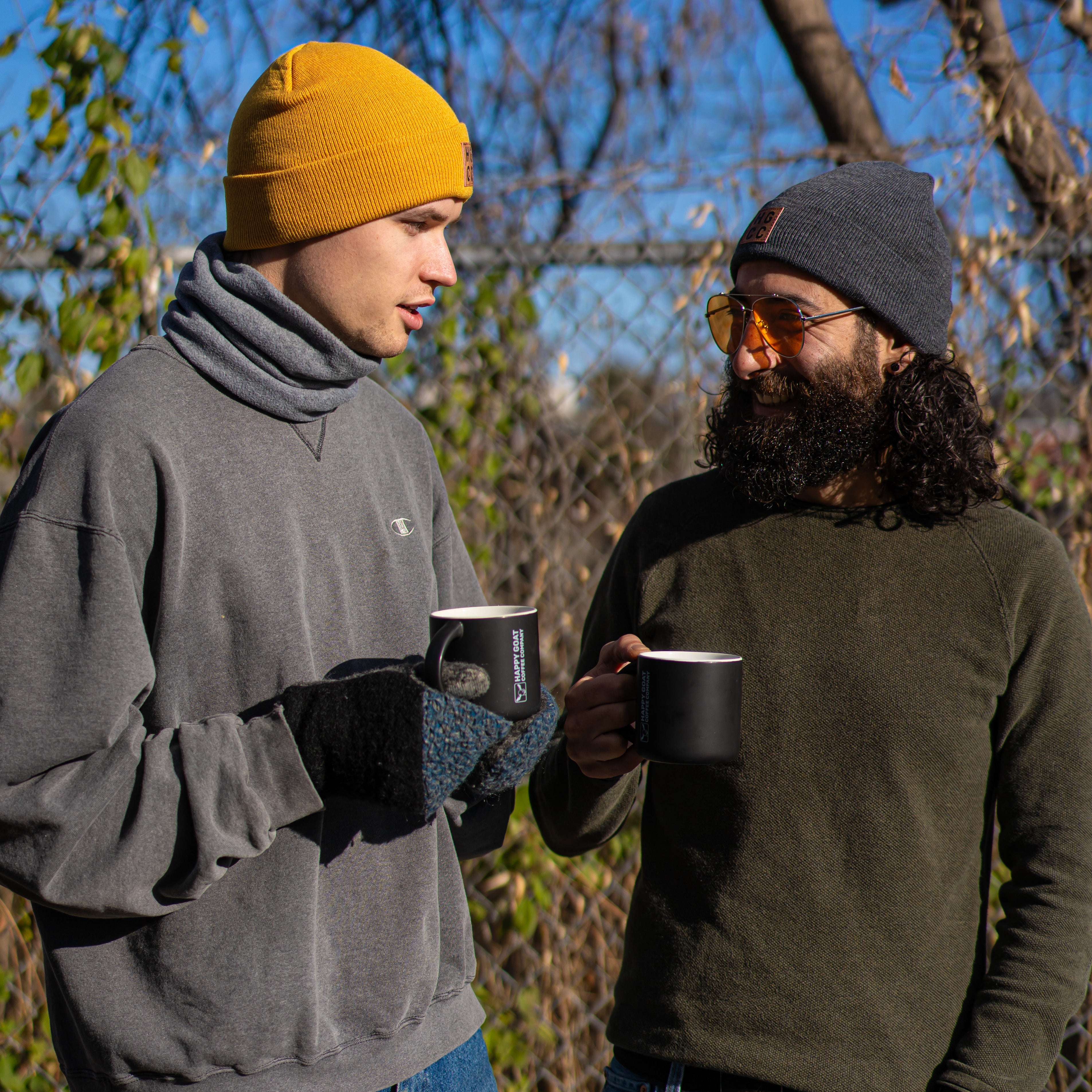 Happy Goat Touque in mustard and in dark grey color, worn by 2 models