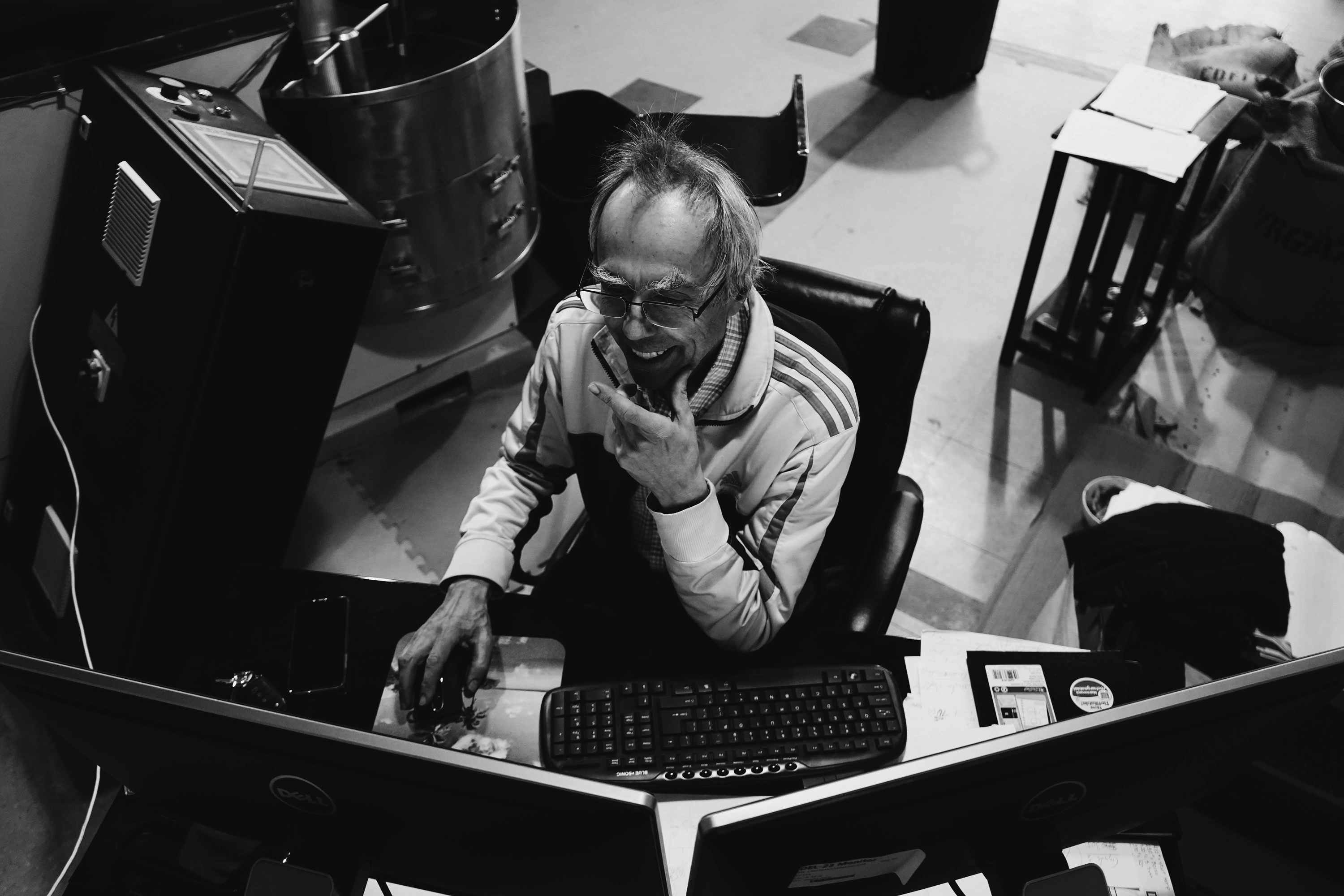 Happy Goat head roaster studying sustainable practices within the coffee industry