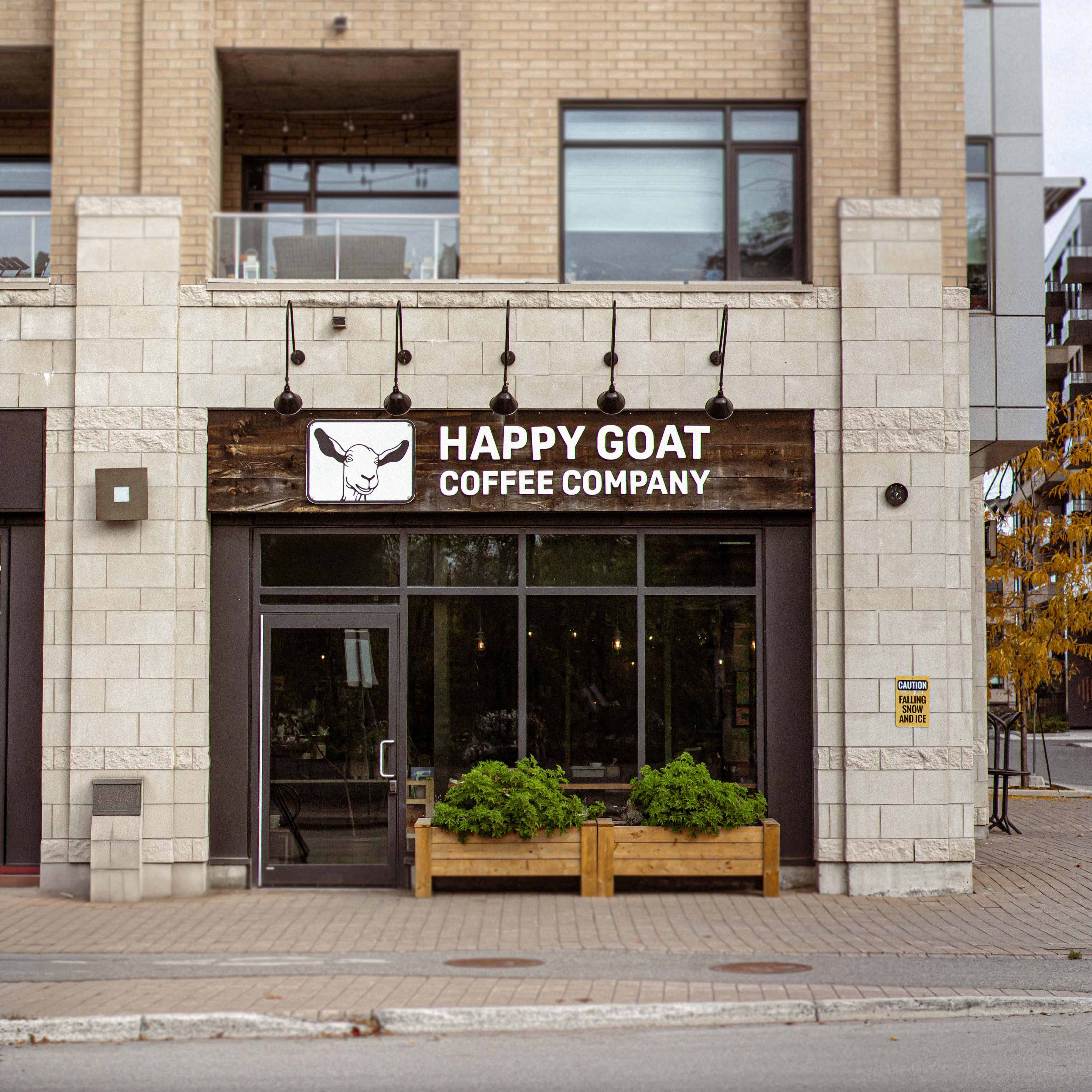 Happy Goat Coffee Company storefront on a city street